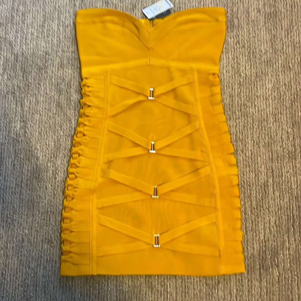 Yellow strapless dress by Bebe with nice sequins on the side